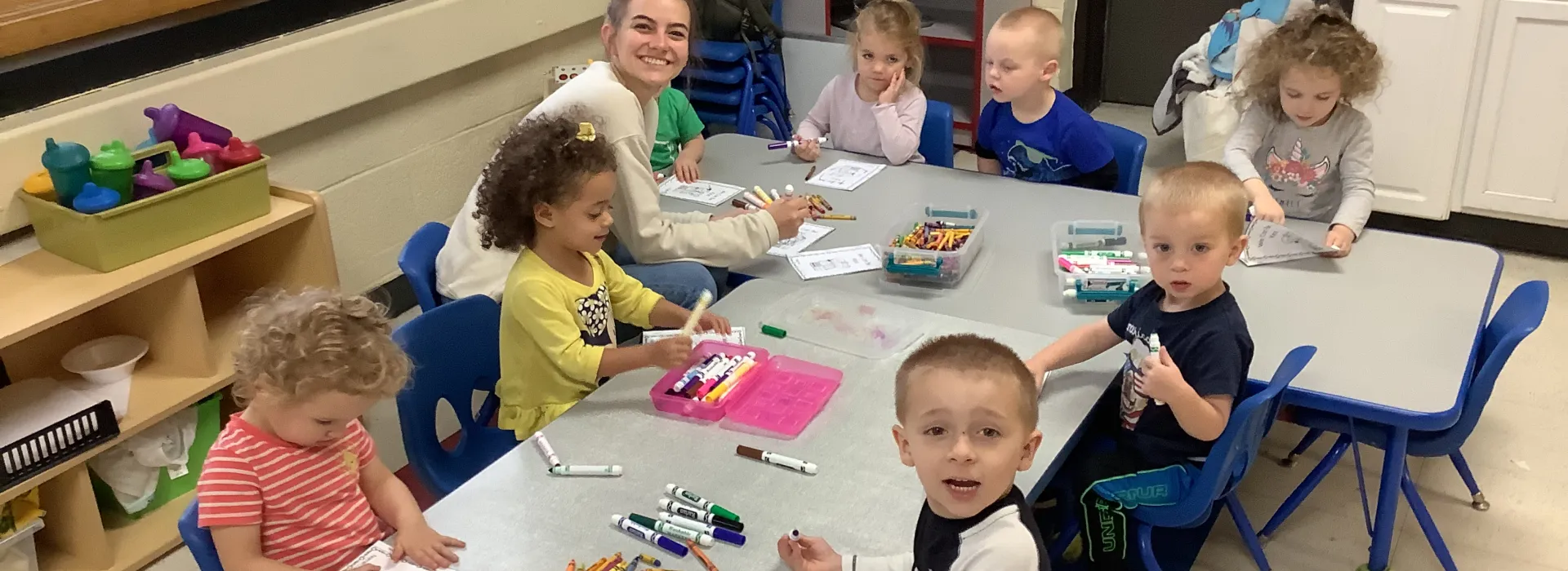 kids coloring at a table